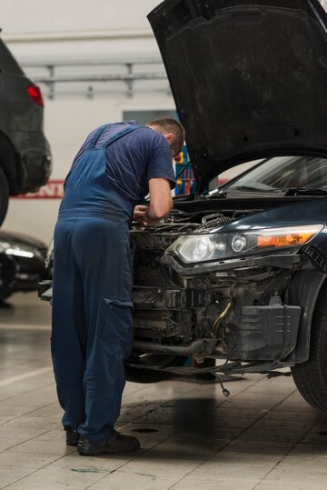 a person working on a auto repair bmw